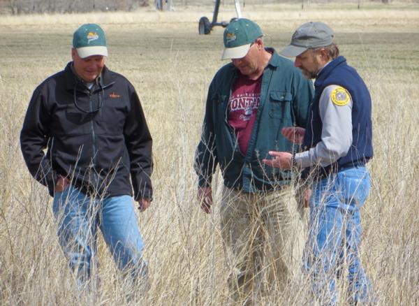 Randy Piearson & Jeff Strum discuss spring seeding project with Canyon Ferry WMA manager, Adam Grove.